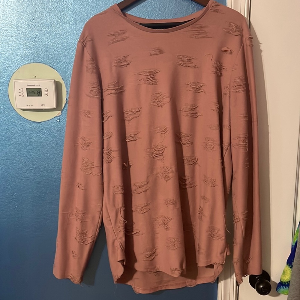 Pink distressed light weight sweater.